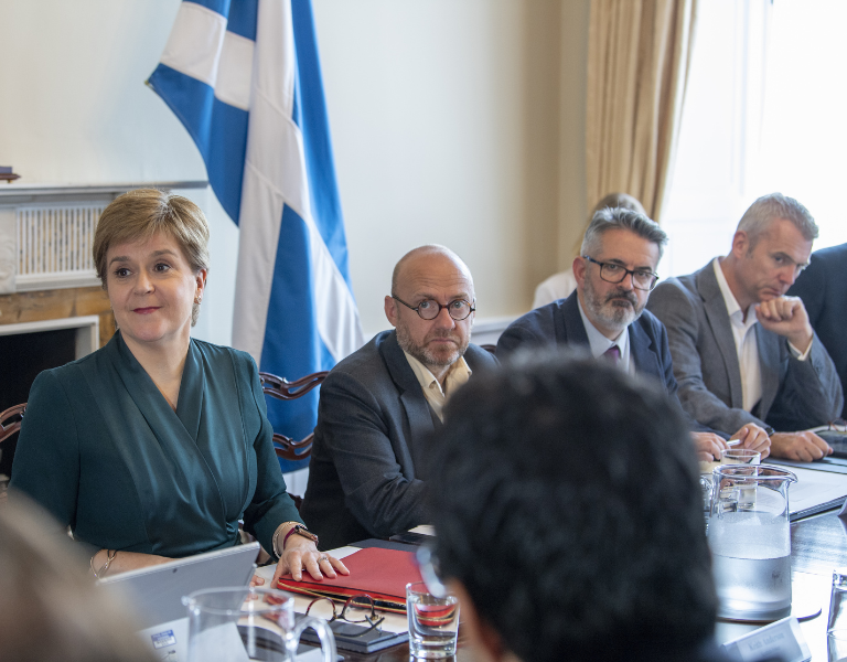 Peter Kelly of the Poverty Alliance, with Nicola Sturgeon at energy summit on 23 August 2022