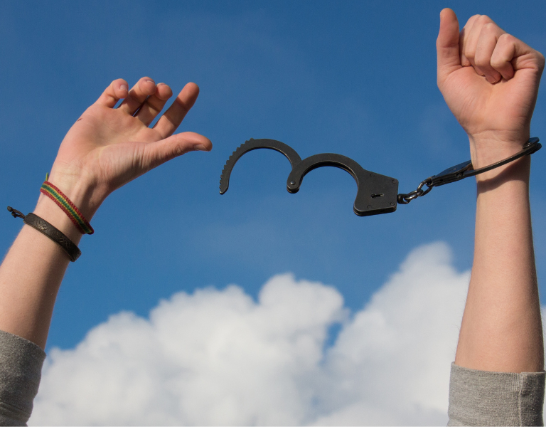 A stock image of someone breaking out of handcuffs