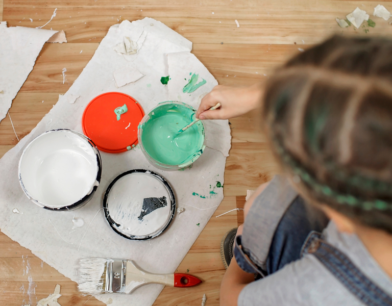 A stock image showing a woman decorating her house.