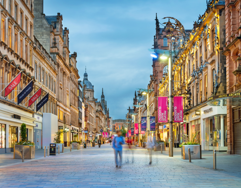 A stock image showing people walking down Buchanan Street in Glasgow.