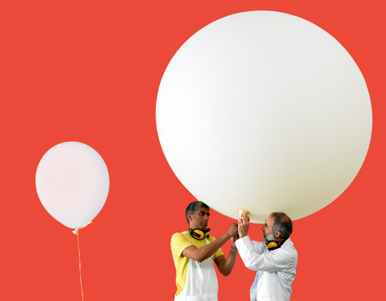 A stock image of two balloons representing our growing collective wealth.