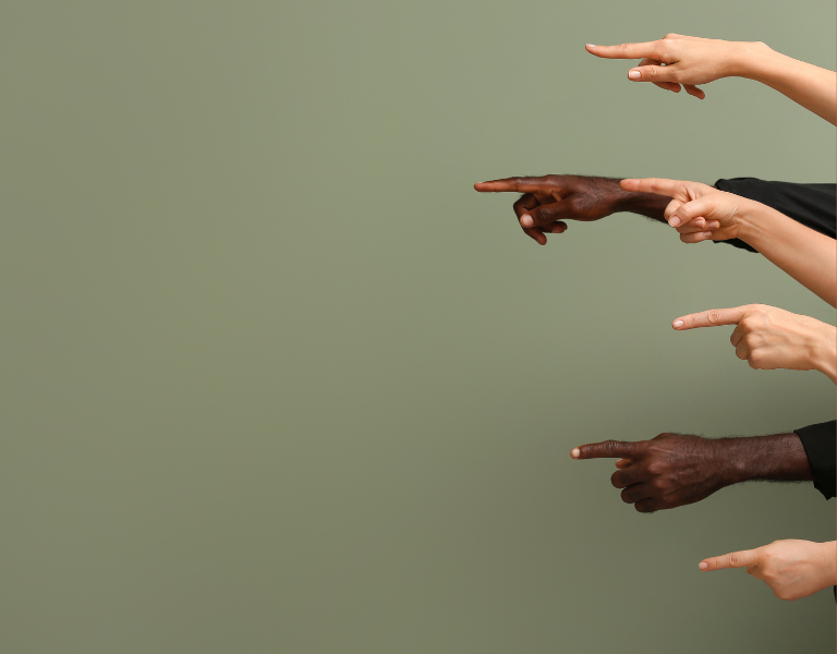 A stock image of fingers pointing at someone, to represent stigma and discrimination