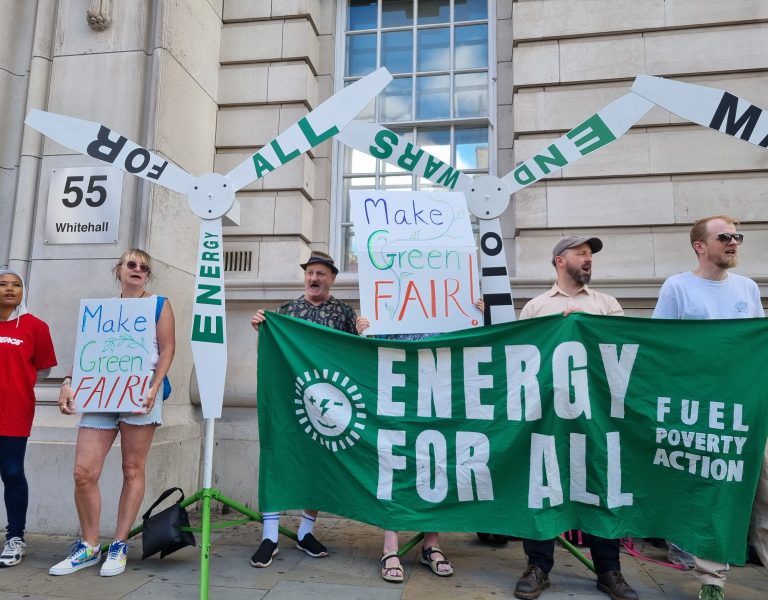 Protestors from the Make Green Fair campaign with banners and placards, campaigning in Whitehall on 1 July 2026.