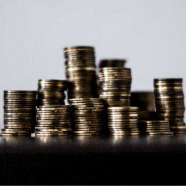 A stock image of stacked money coins